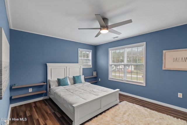 bedroom featuring dark wood-type flooring and ceiling fan