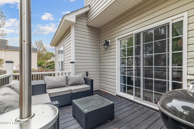 wooden deck featuring outdoor lounge area