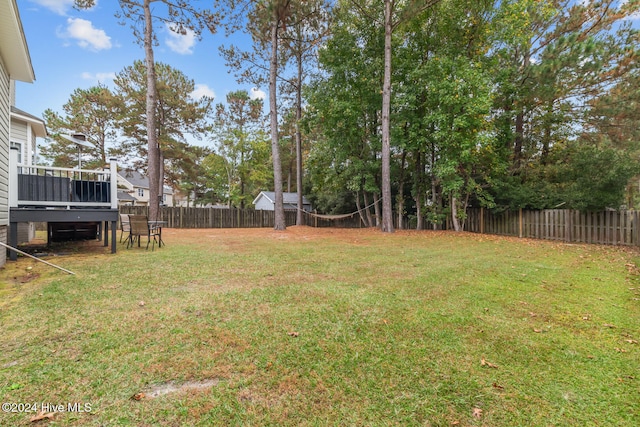 view of yard with a deck