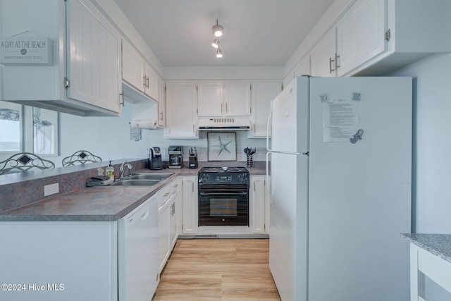 kitchen with tasteful backsplash, exhaust hood, light hardwood / wood-style floors, white cabinets, and white appliances