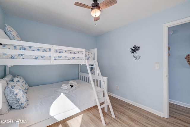 bedroom featuring hardwood / wood-style flooring and ceiling fan