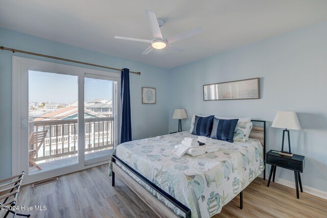 bedroom with hardwood / wood-style flooring, ceiling fan, and access to exterior