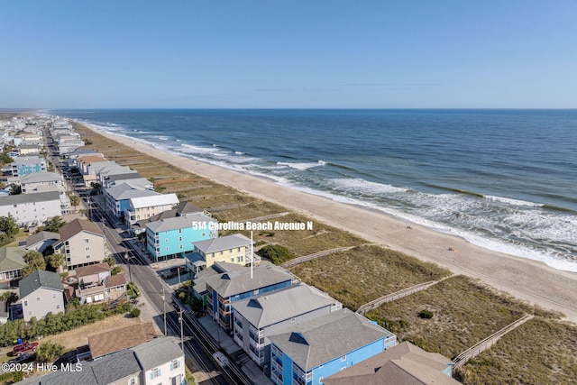 aerial view featuring a water view and a beach view