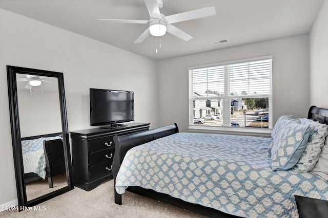 bedroom featuring ceiling fan and light colored carpet