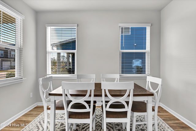 dining area with hardwood / wood-style floors and plenty of natural light