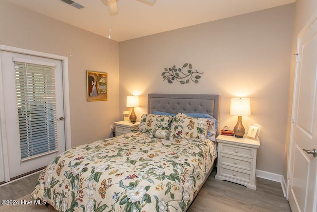 bedroom featuring hardwood / wood-style flooring and ceiling fan