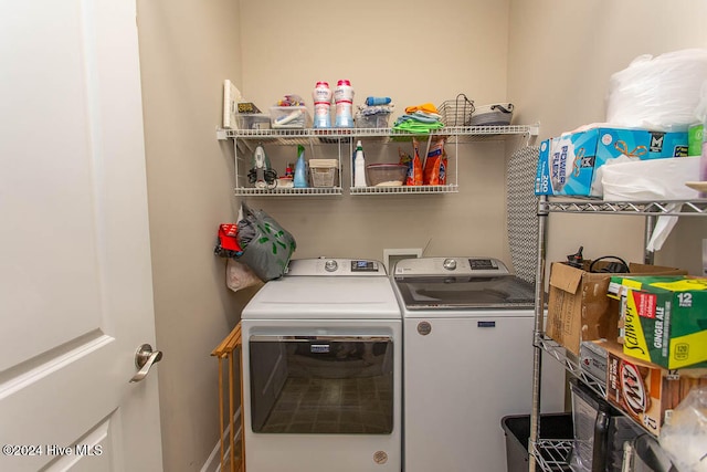 clothes washing area with washer and dryer