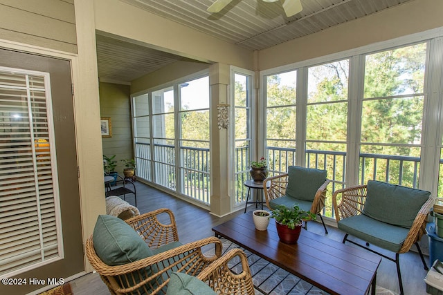 sunroom featuring ceiling fan