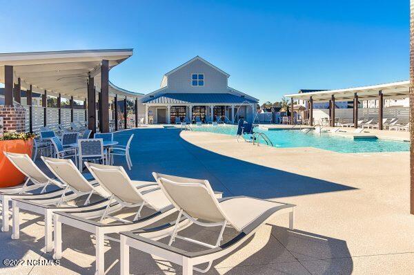 view of pool featuring a patio