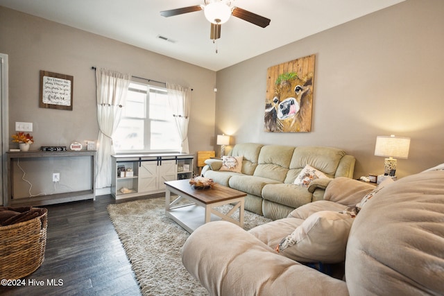 living room featuring dark hardwood / wood-style floors and ceiling fan