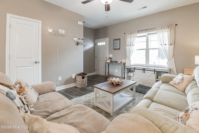 living room with dark hardwood / wood-style floors and ceiling fan