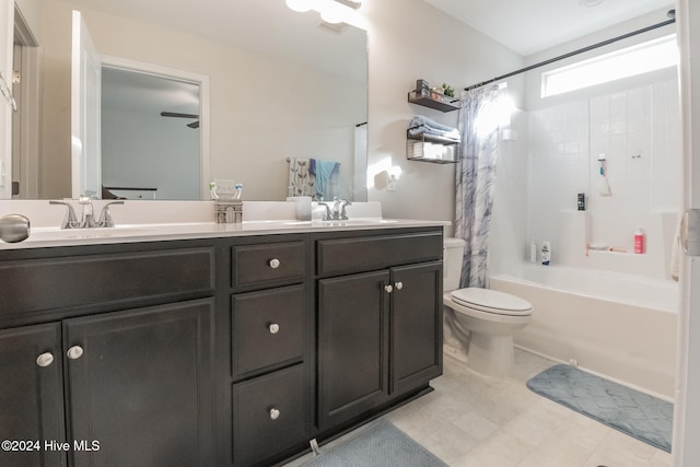 full bathroom with toilet, vanity, and shower / bath combination with curtain