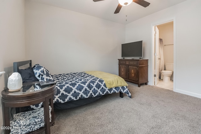 carpeted bedroom with ceiling fan and connected bathroom