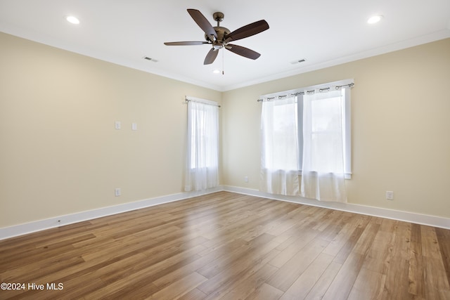 304 Birmingham Ave Unit 2, Carolina Beach, NC 28428 - empty room with crown molding, light wood finished floors, a ceiling fan, baseboards, and recessed lighting