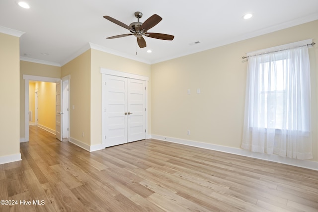304 Birmingham Ave Unit 2, Carolina Beach, NC 28428 - unfurnished bedroom with recessed lighting, light wood-type flooring, crown molding, baseboards, and a closet