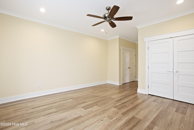 304 Birmingham Ave Unit 2, Carolina Beach, NC 28428 - unfurnished bedroom featuring light wood finished floors, baseboards, ornamental molding, recessed lighting, and a closet