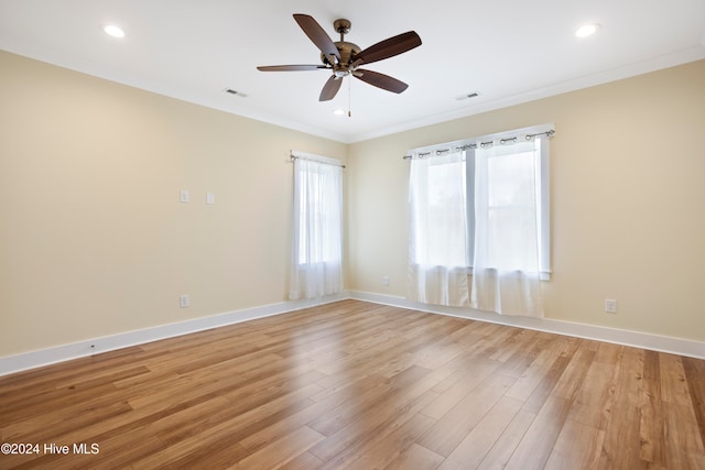 unfurnished room featuring light wood-type flooring, ceiling fan, and ornamental molding