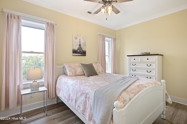 304 Birmingham Ave Unit 2, Carolina Beach, NC 28428 - bedroom with wood finished floors, baseboards, crown molding, and a ceiling fan