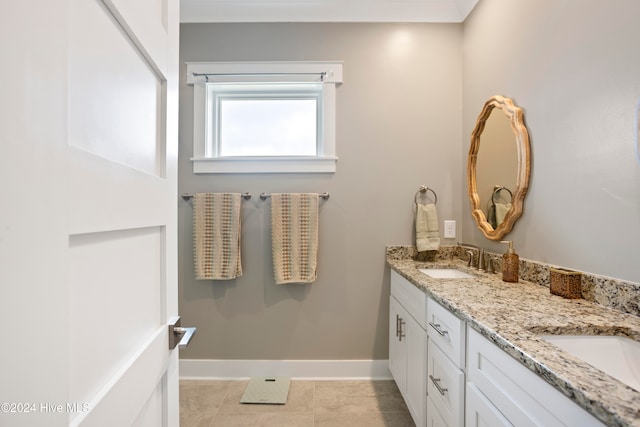 bathroom with tile patterned floors and vanity