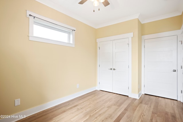 unfurnished bedroom with a closet, ceiling fan, light hardwood / wood-style flooring, and ornamental molding