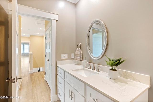 bathroom featuring hardwood / wood-style floors and vanity