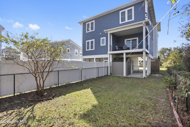 304 Birmingham Ave Unit 2, Carolina Beach, NC 28428 - back of property featuring a balcony, a storage unit, and an outdoor structure