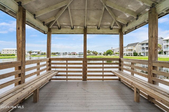 dock area featuring a gazebo and a deck with water view