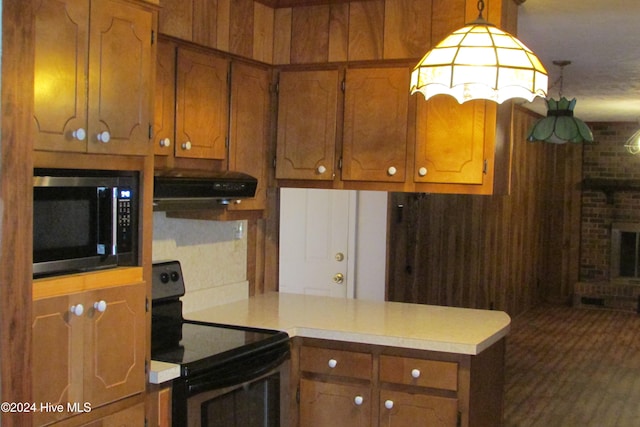 kitchen featuring black electric range, kitchen peninsula, and hanging light fixtures