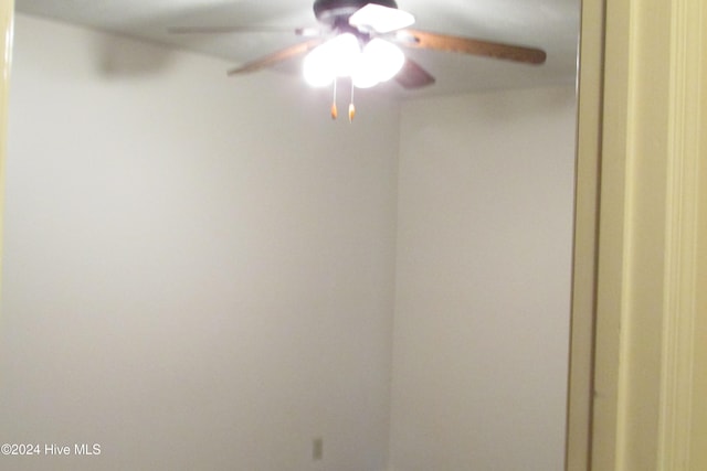 interior space featuring ceiling fan