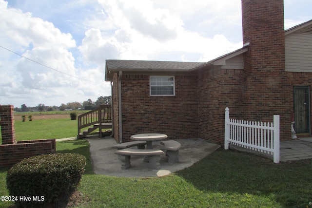 exterior space featuring a patio area and a yard