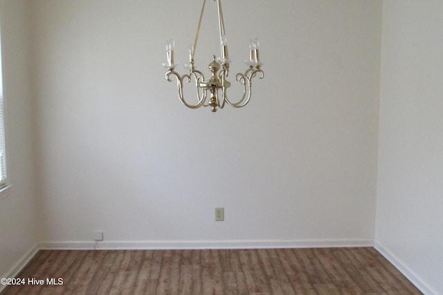 empty room featuring dark wood-type flooring