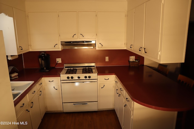 kitchen with white range with gas cooktop, sink, white cabinets, dark hardwood / wood-style floors, and range hood