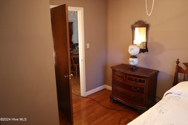 bedroom with hardwood / wood-style flooring