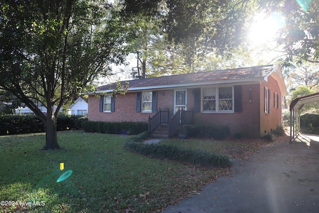 ranch-style house with a front lawn