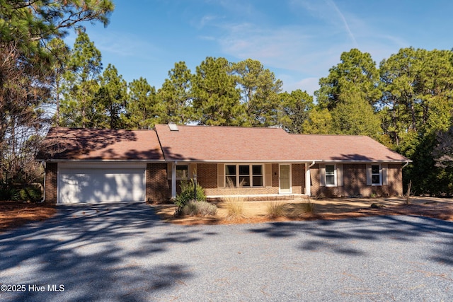 single story home with a garage