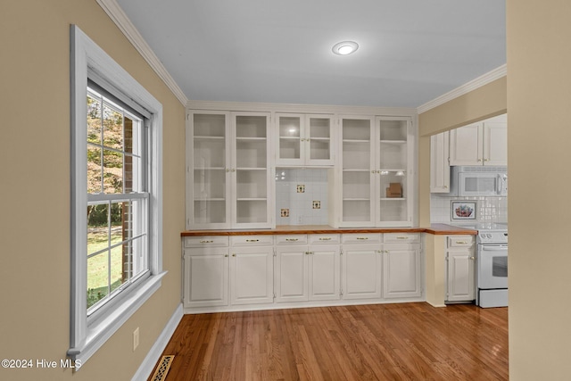 kitchen with white cabinetry, white appliances, decorative backsplash, and light wood-type flooring