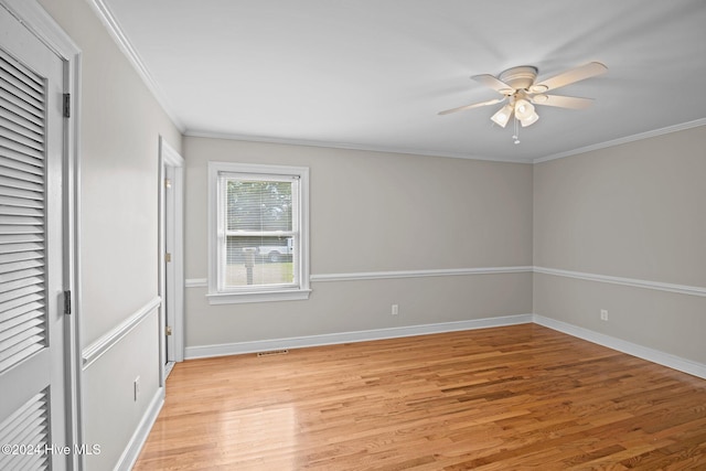 interior space featuring light hardwood / wood-style floors, ceiling fan, and crown molding