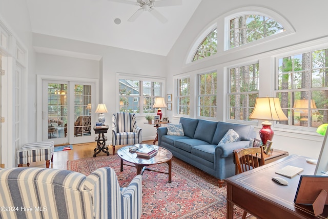 sunroom featuring vaulted ceiling and ceiling fan