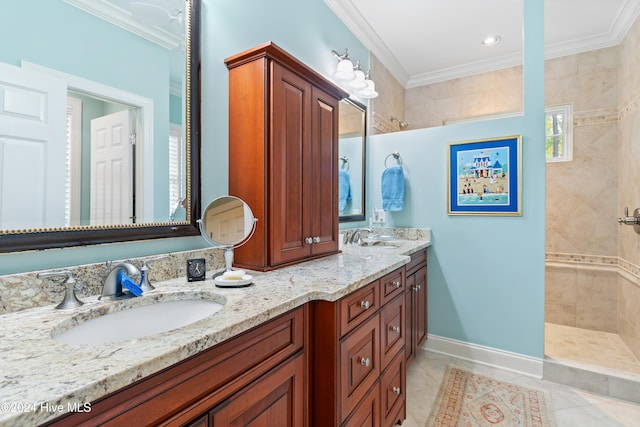 bathroom featuring a tile shower, tile patterned flooring, vanity, and ornamental molding