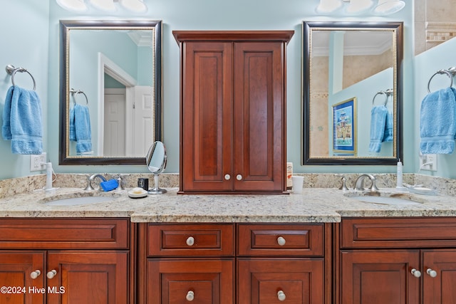 bathroom featuring vanity and crown molding