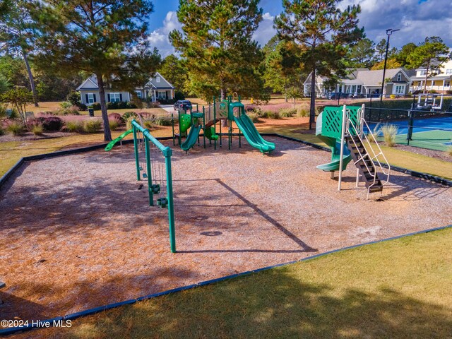 view of playground featuring tennis court