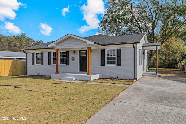 view of front of house with a front yard and a porch