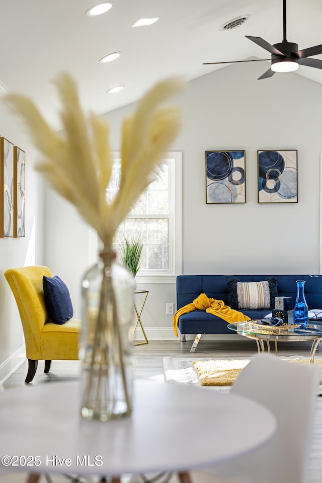 sitting room featuring ceiling fan, lofted ceiling, and hardwood / wood-style flooring