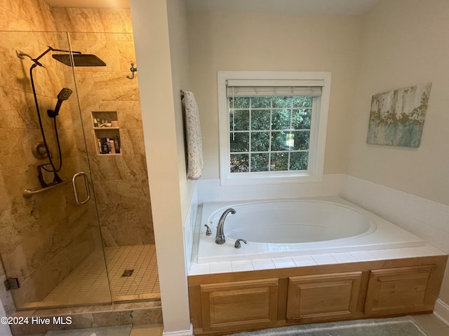 bathroom with separate shower and tub