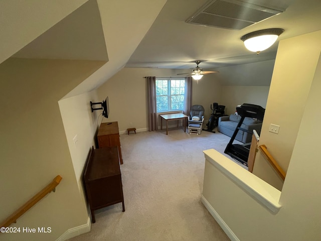 interior space with ceiling fan and lofted ceiling