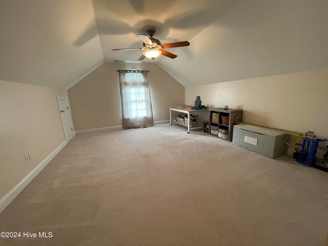 bonus room with vaulted ceiling, carpet, and ceiling fan