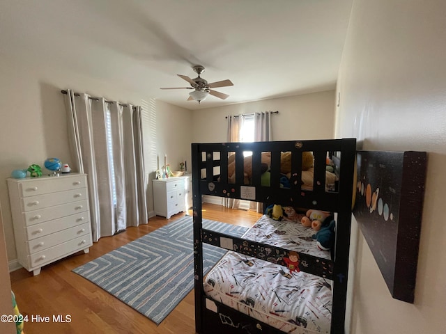 bedroom with hardwood / wood-style flooring and ceiling fan