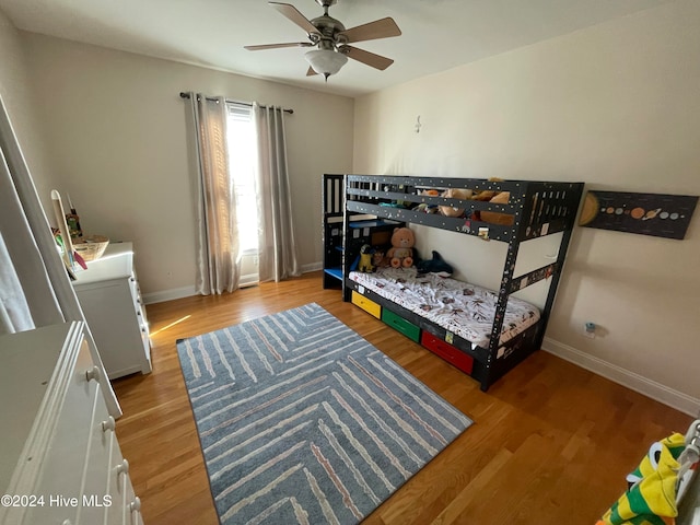 bedroom featuring ceiling fan and wood-type flooring