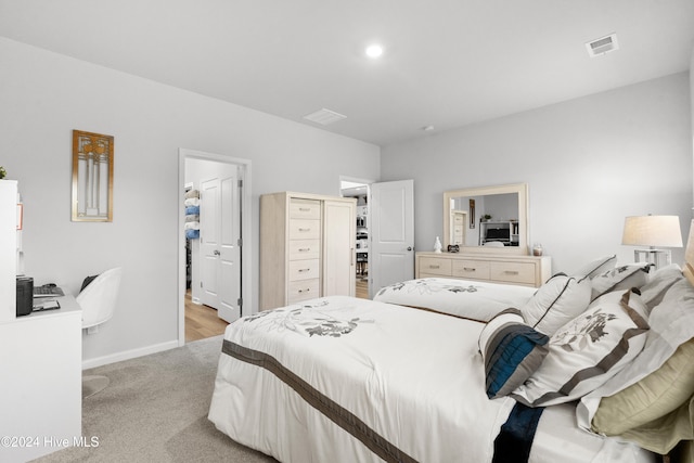 carpeted bedroom featuring a closet