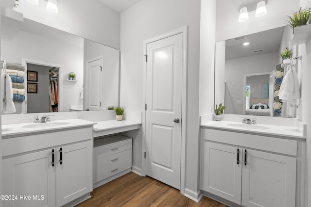 bathroom featuring vanity and wood-type flooring